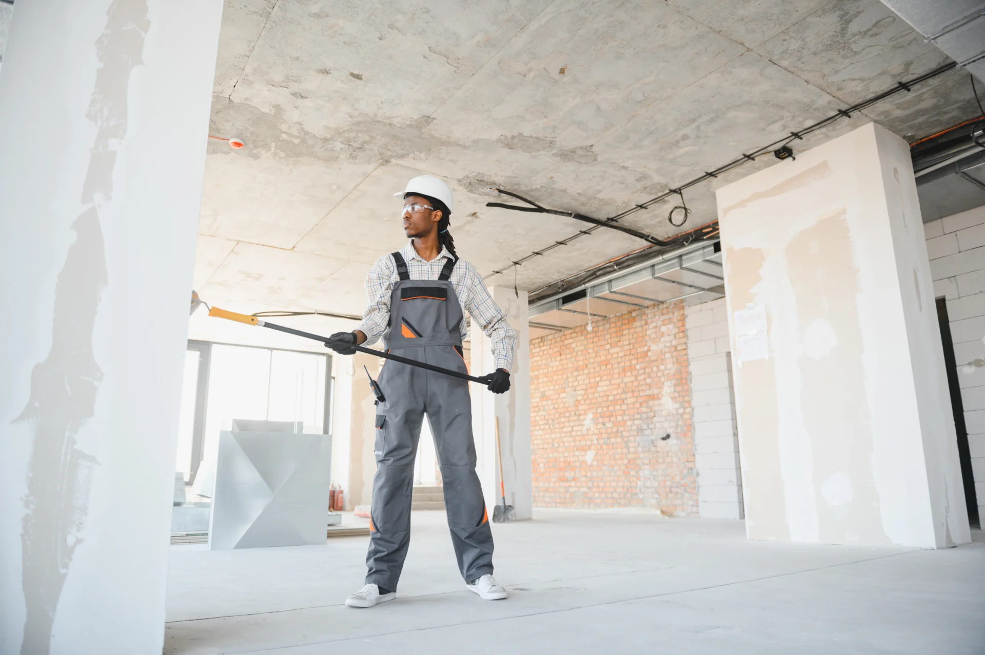 construction-worker-painting-wall-with-roller-in-b-2026-03-25-07-35-31-utc