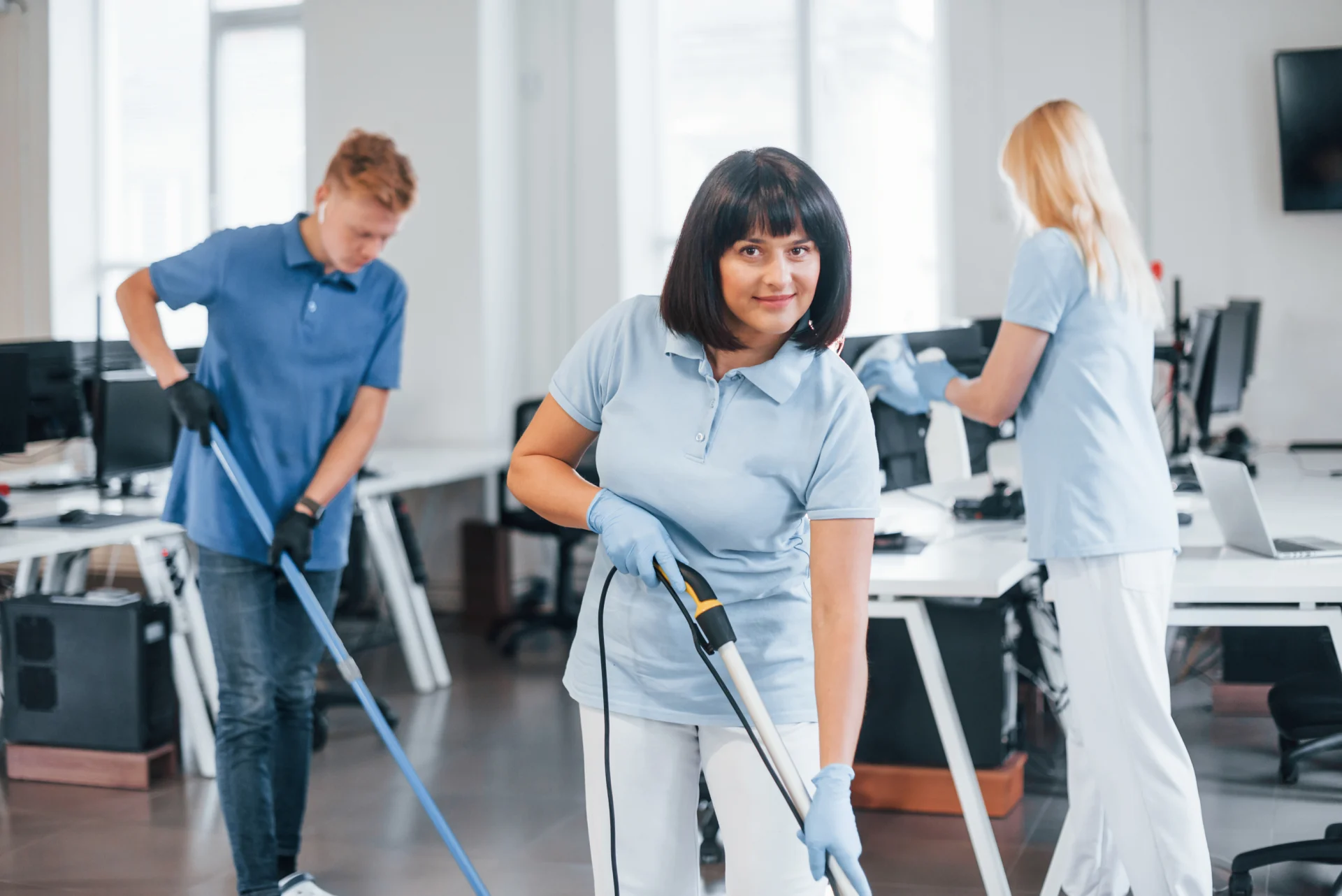 woman-uses-vacuum-cleaner-group-of-workers-clean-2026-01-08-23-30-44-utc